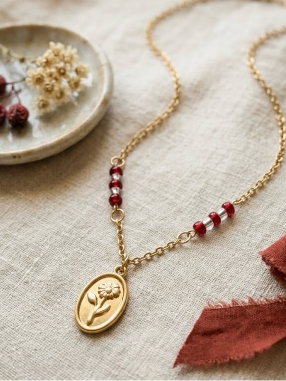 Gold Floral Medallion Necklace with Red Bead Accents